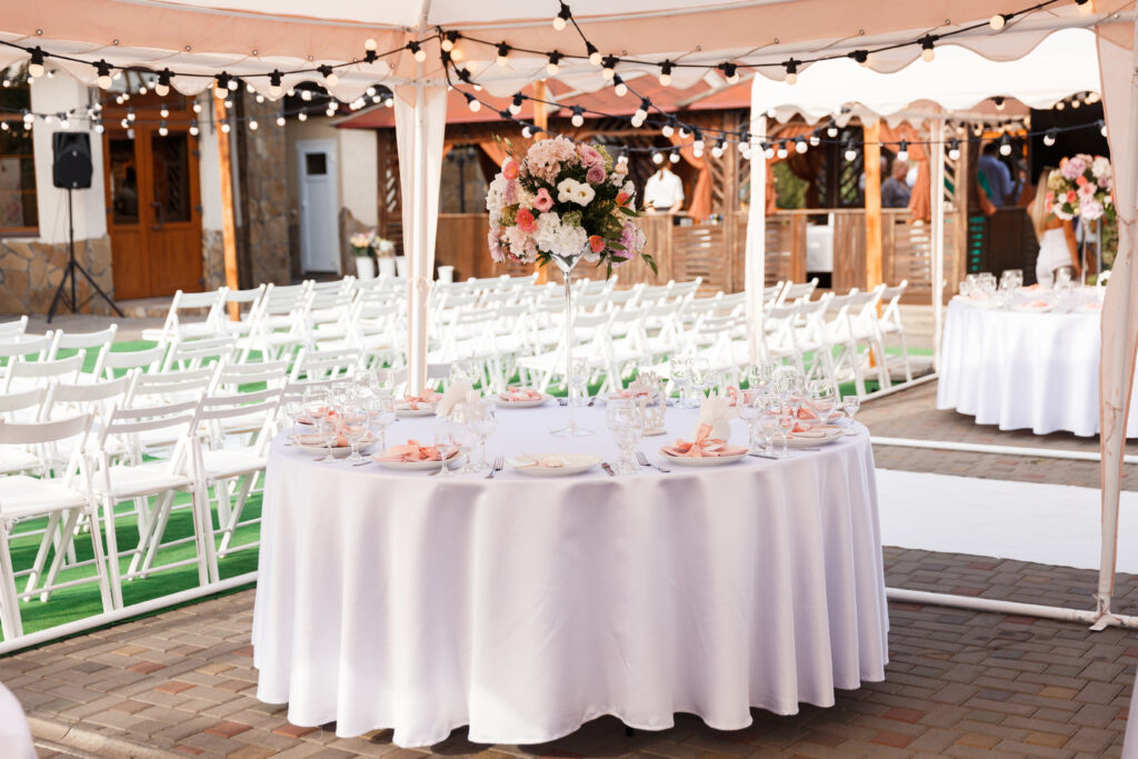 | Tables for guests decorated at the banquet