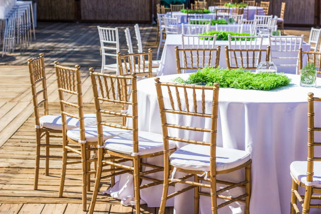 | wedding bright pastel and white terrace exterior outdoor environment from dinner banquet event design concept photography  with furniture and dishes