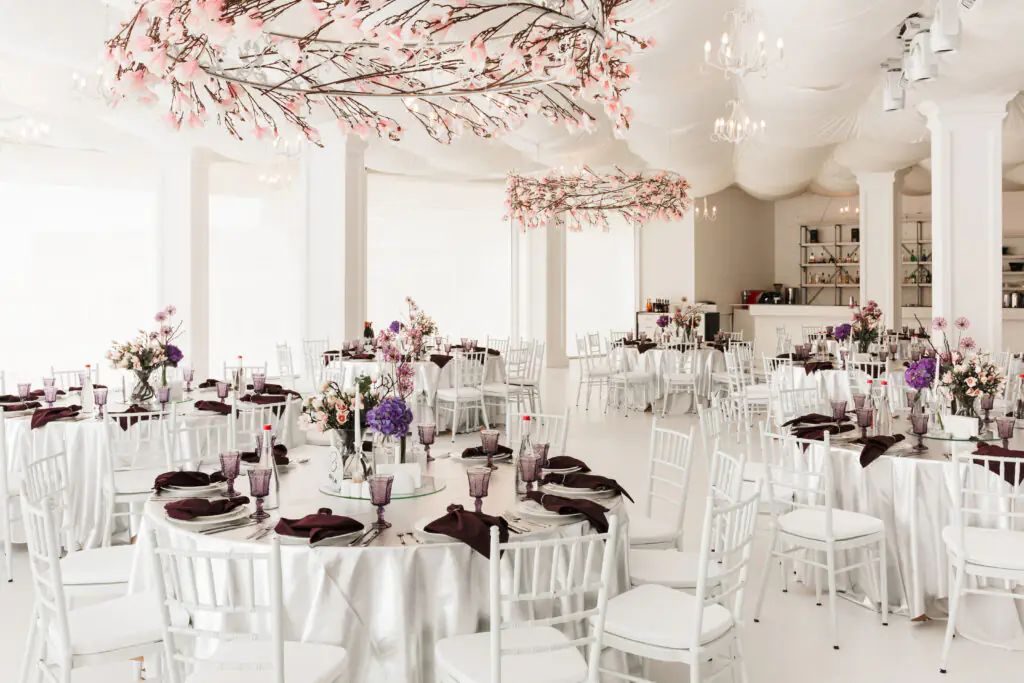 | Photo of beautiful white wedding hall with big tables isolated